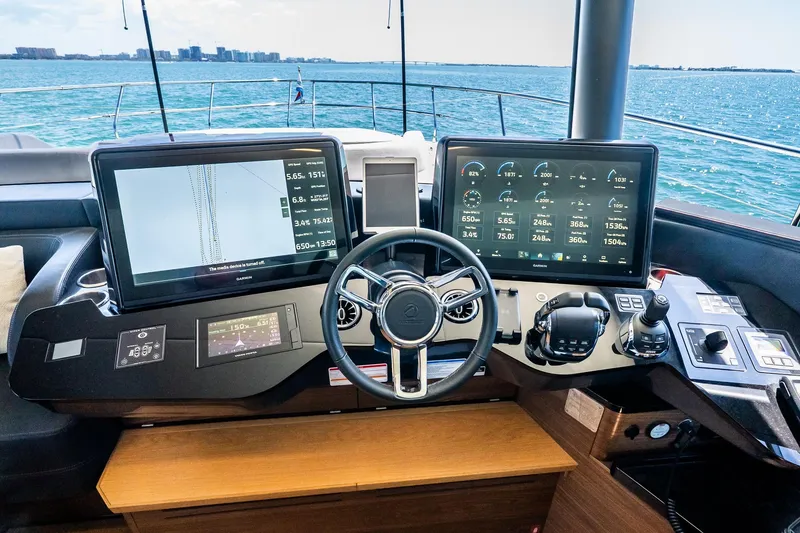 Slide: The Image of Cockpit of 2022 Absolute 64 Navetta yacht with advanced navigation displays. - 78