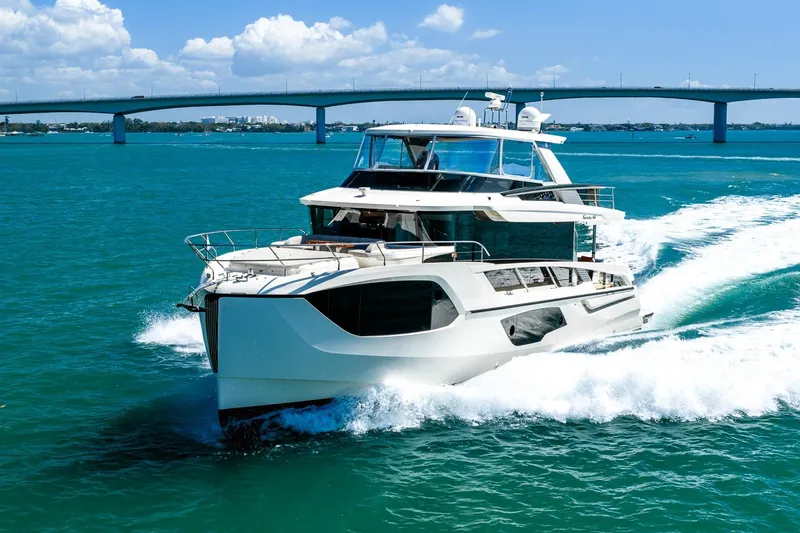 The Image of Luxurious 2022 Absolute 64 Navetta yacht cruising on vibrant blue waters. - 0