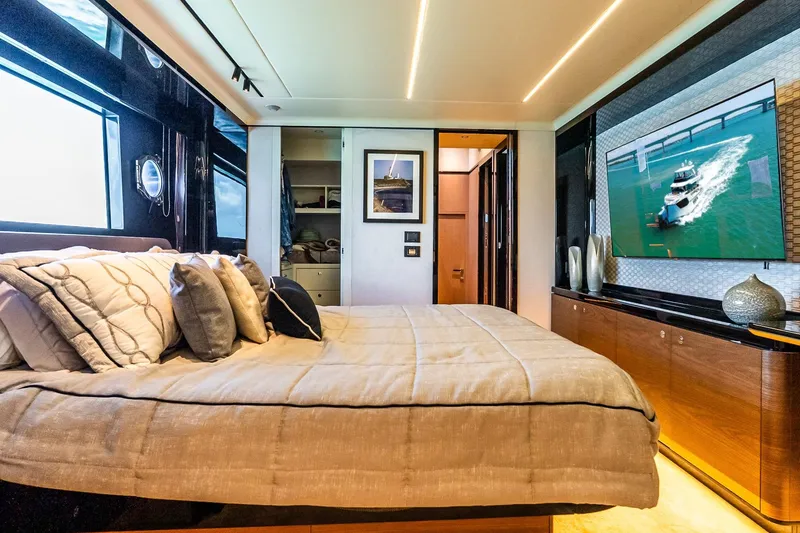 Slide: The Image of Luxurious bedroom interior on 2022 Absolute 64 Navetta yacht, featuring elegant decor and modern amenities. - 92