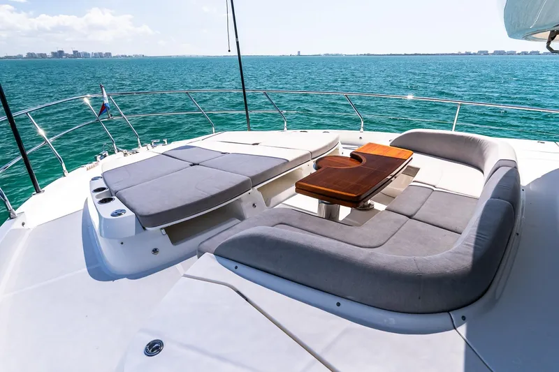 Slide: The Image of Luxurious 2022 Absolute 64 Navetta yacht deck with elegant seating and ocean view. - 29