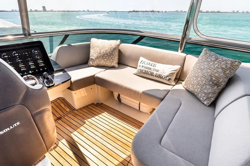 Slide: The Image of Luxurious interior of 2022 Absolute 64 Navetta yacht with plush seating and scenic ocean view. - 51