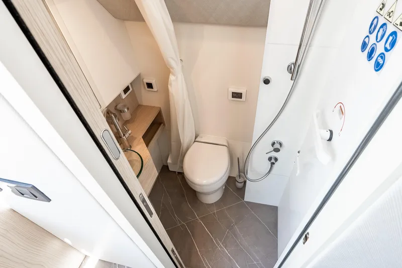 Slide: The Image of Luxurious bathroom in 2022 Absolute 64 Navetta yacht with modern fixtures and elegant design. - 104
