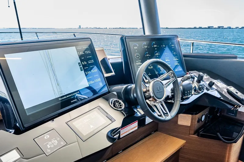 Slide: The Image of Cockpit of 2022 Absolute 64 Navetta yacht with advanced navigation displays. - 79