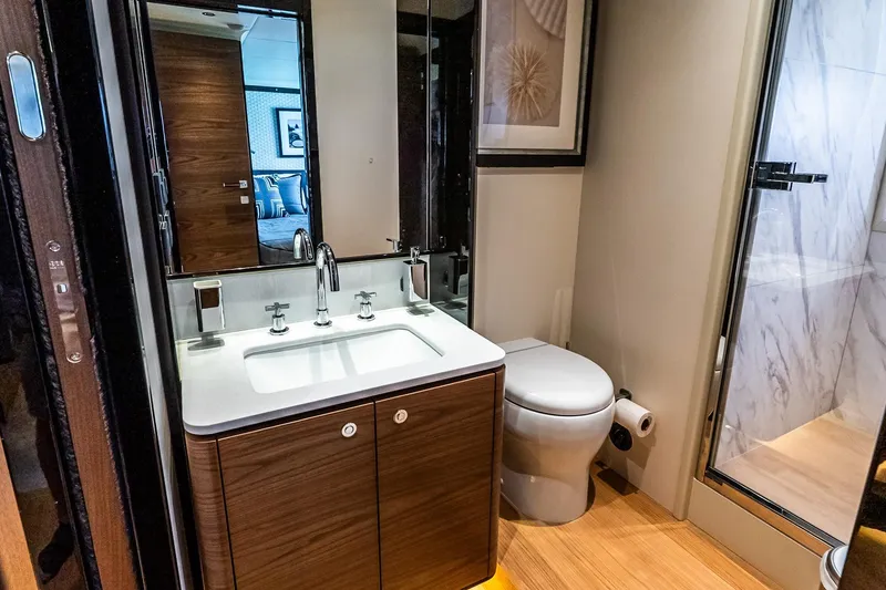 Slide: The Image of Luxurious bathroom interior on 2022 Absolute 64 Navetta yacht, featuring modern fixtures and elegant design. - 100