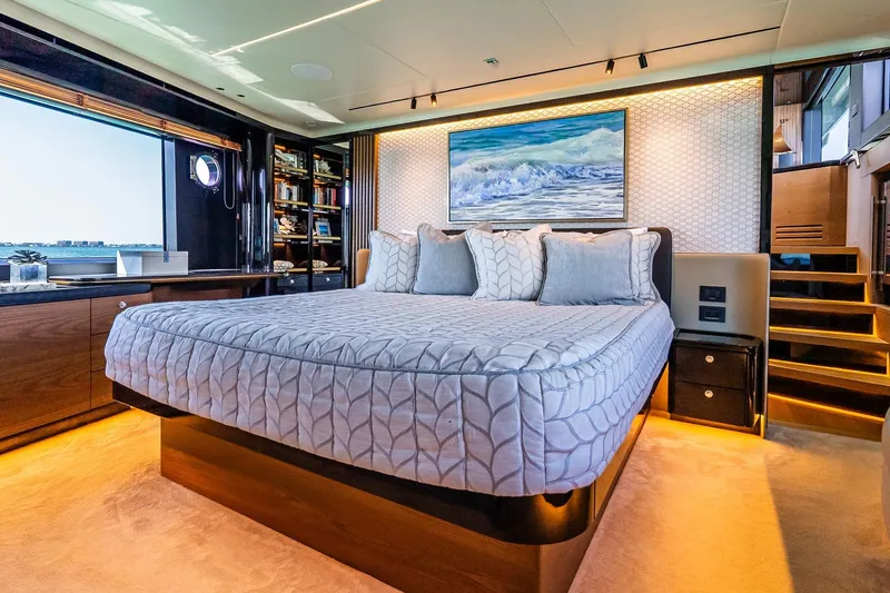 Slide: The Image of Luxurious bedroom interior on 2022 Absolute 64 Navetta yacht with elegant decor and ocean view. - 88
