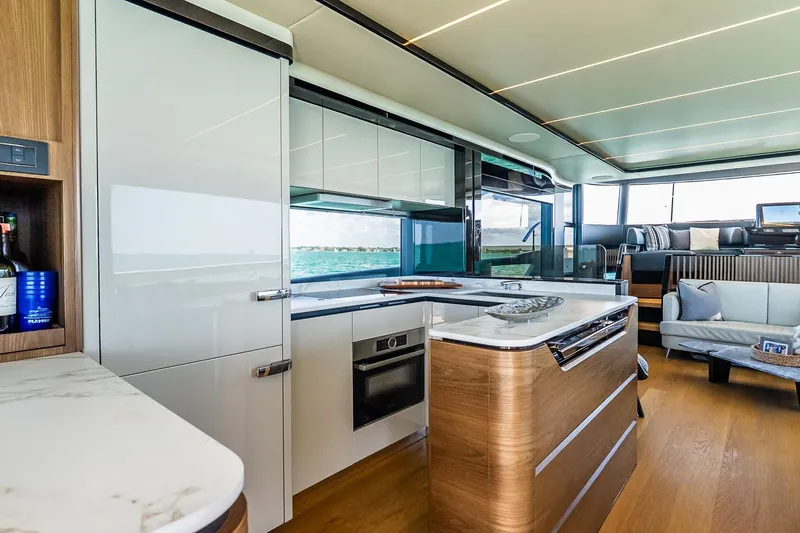 Slide: The Image of Luxurious interior of 2022 Absolute 64 Navetta yacht with modern kitchen and seating area. - 66