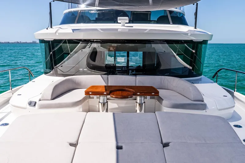 Slide: The Image of Luxurious 2022 Absolute 64 Navetta yacht with spacious deck seating and ocean view. - 24