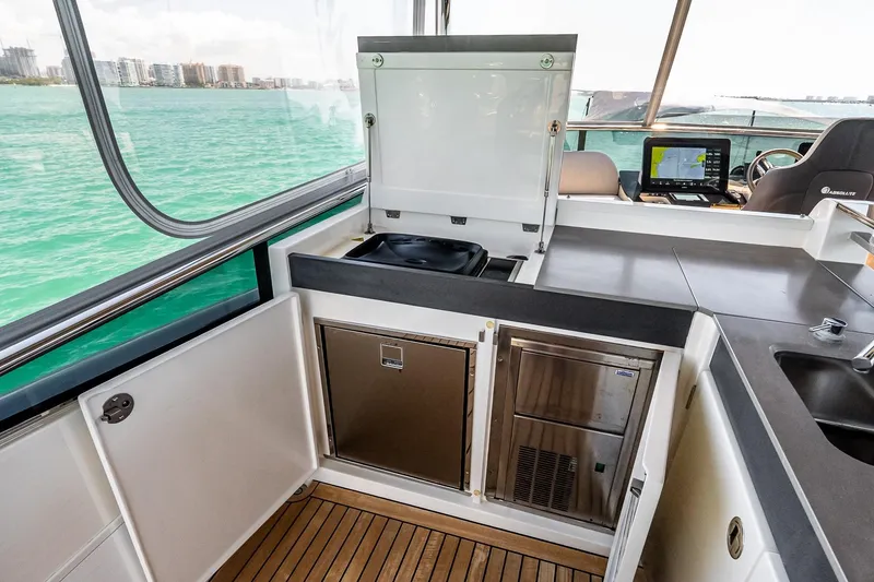 Slide: The Image of Modern kitchen area on 2022 Absolute 64 Navetta yacht with ocean view. - 43