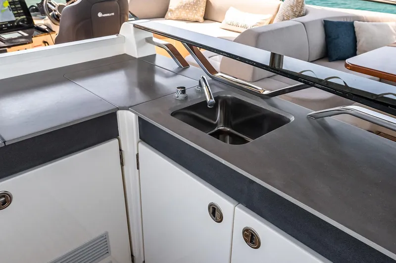 Slide: The Image of Modern kitchen area on 2022 Absolute 64 Navetta yacht with sleek sink and countertop. - 45