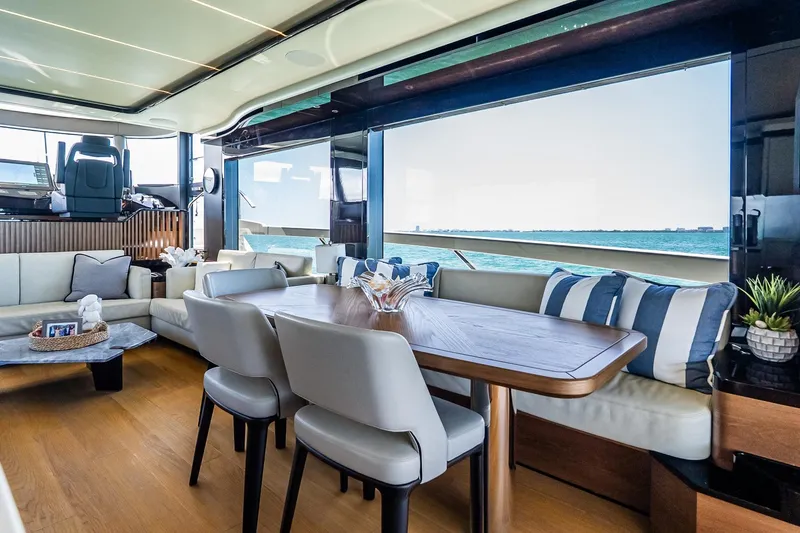 Slide: The Image of Luxurious interior of 2022 Absolute 64 Navetta yacht with ocean view and elegant seating. - 68