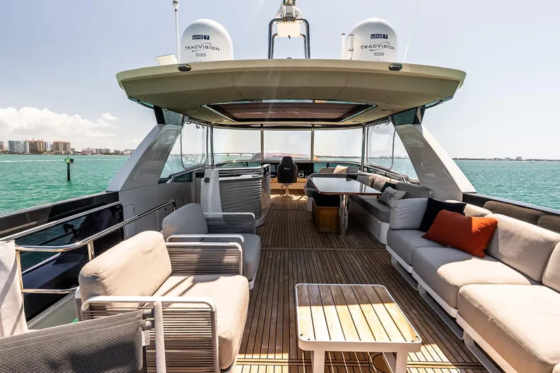 Slide: The Image of Luxurious 2022 Absolute 64 Navetta yacht deck with elegant seating and ocean view. - 34