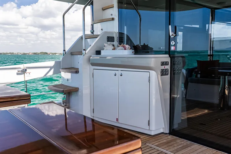 Slide: The Image of Luxurious 2022 Absolute 64 Navetta yacht deck with sleek design and ocean view. - 63