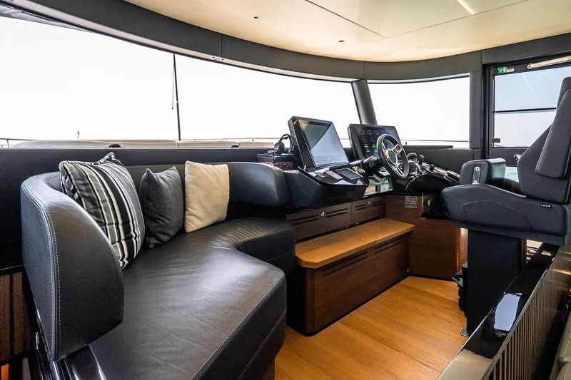 Slide: The Image of Luxurious interior of 2022 Absolute 64 Navetta yacht with modern helm and plush seating. - 75
