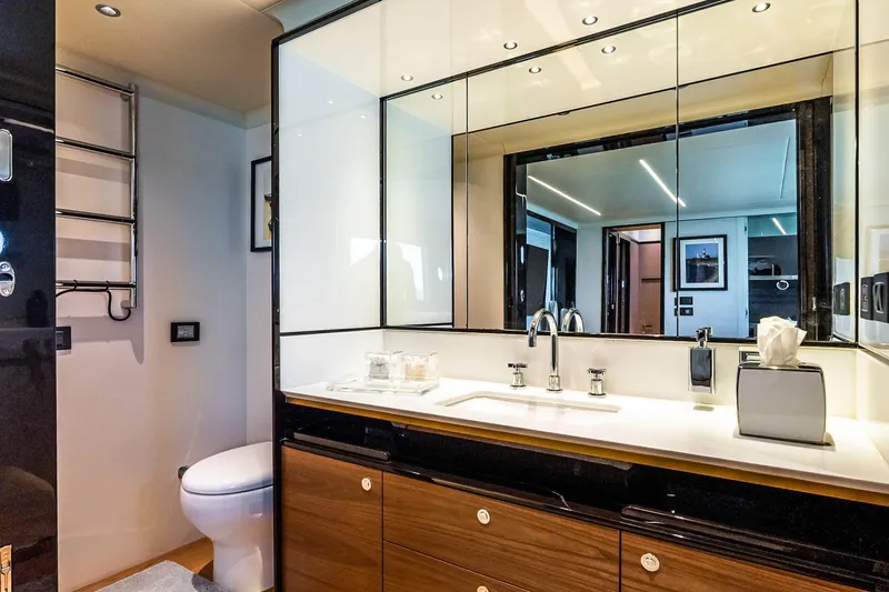 Slide: The Image of Luxurious bathroom interior on 2022 Absolute 64 Navetta yacht, featuring modern fixtures and elegant design. - 94