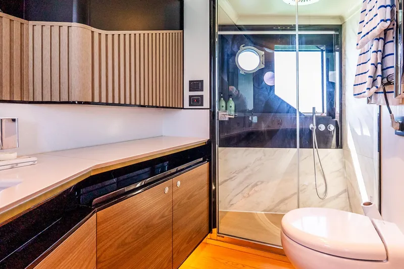 Slide: The Image of Luxurious bathroom interior on 2022 Absolute 64 Navetta yacht, featuring modern design and elegant finishes. - 90