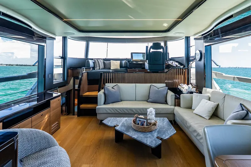 Slide: The Image of Luxurious interior of 2022 Absolute 64 Navetta yacht with elegant seating and panoramic views. - 69