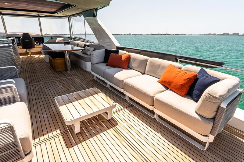 Slide: The Image of Luxurious 2022 Absolute 64 Navetta yacht deck with elegant seating and ocean view. - 35