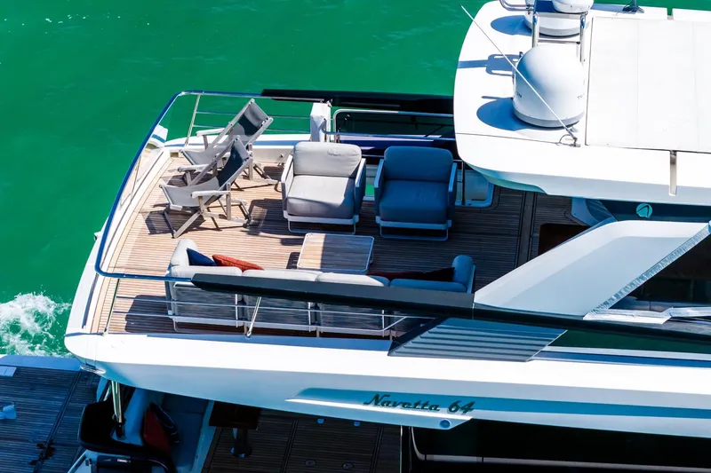Slide: The Image of Aerial view of 2022 Absolute 64 Navetta yacht's deck with seating area. - 22