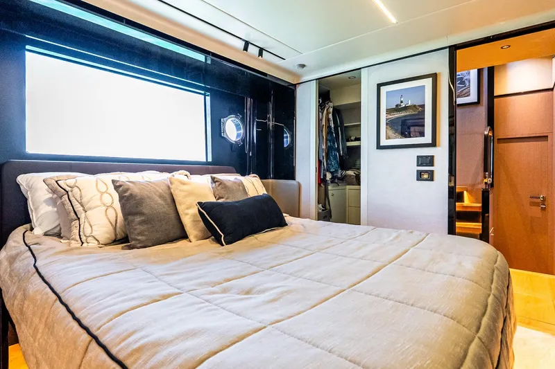 Slide: The Image of Luxurious bedroom interior of 2022 Absolute 64 Navetta yacht with modern decor and cozy bedding. - 93