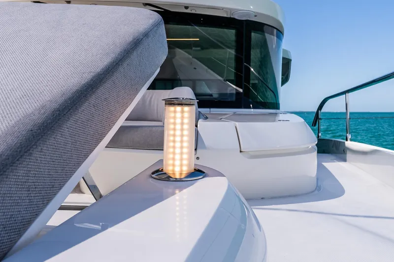 Slide: The Image of Luxurious Absolute 64 Navetta yacht deck with modern seating and ocean view, 2022 model. - 31
