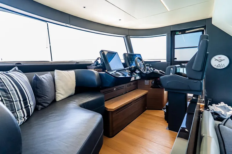 Slide: The Image of Luxurious interior of 2022 Absolute 64 Navetta yacht with modern helm and seating area. - 76