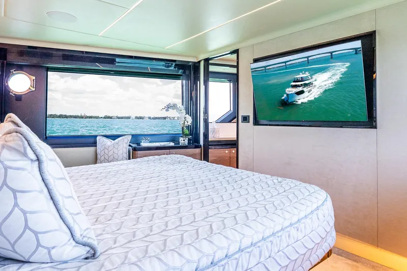Slide: The Image of Luxurious bedroom on 2022 Absolute 64 Navetta yacht with ocean view and TV. - 84