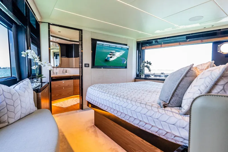 Slide: The Image of Luxurious bedroom interior of 2022 Absolute 64 Navetta yacht with elegant decor and large windows. - 83