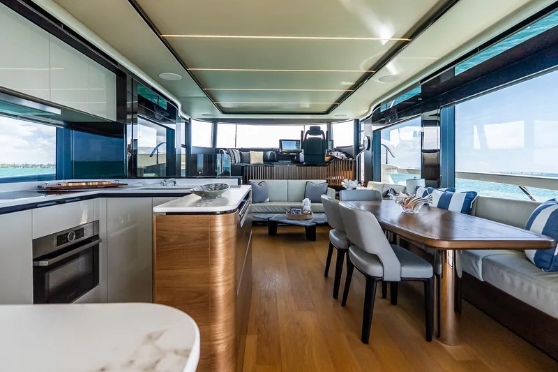 Slide: The Image of Luxurious interior of 2022 Absolute 64 Navetta yacht with modern dining and seating area. - 65