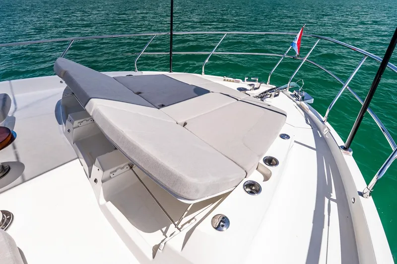 Slide: The Image of Luxurious sunbed on 2022 Absolute 64 Navetta yacht, overlooking serene turquoise waters. - 26