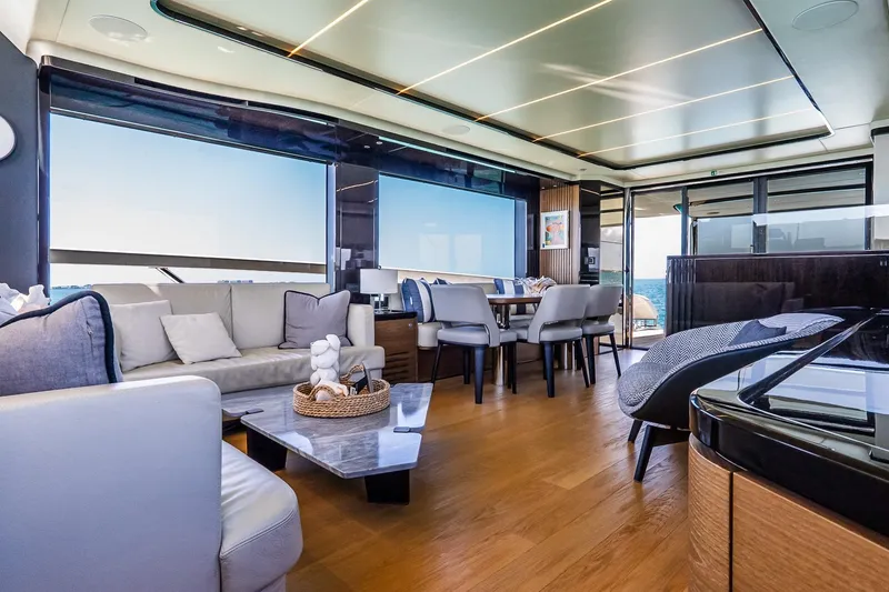 Slide: The Image of Luxurious interior of 2022 Absolute 64 Navetta yacht with modern furnishings and panoramic windows. - 71