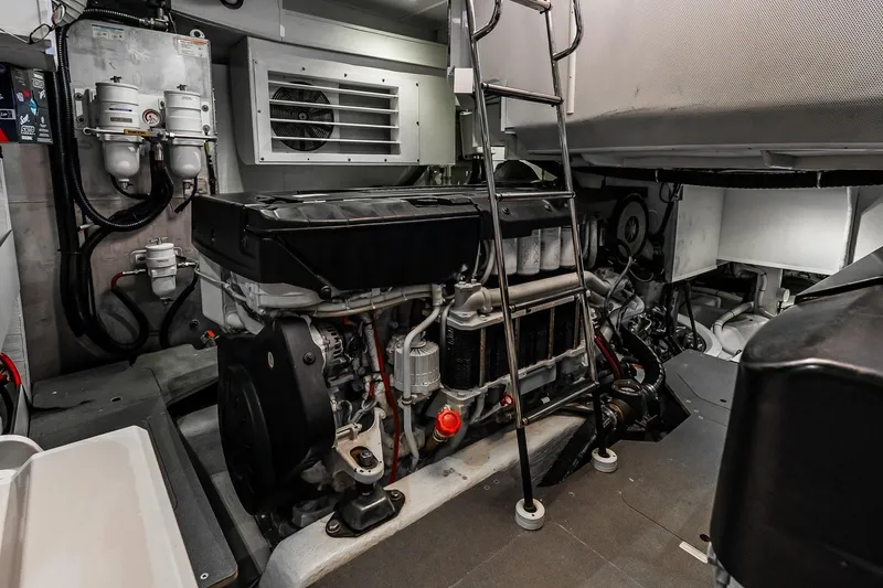 Slide: The Image of Engine room of 2022 Absolute 64 Navetta yacht, featuring advanced machinery and equipment. - 109