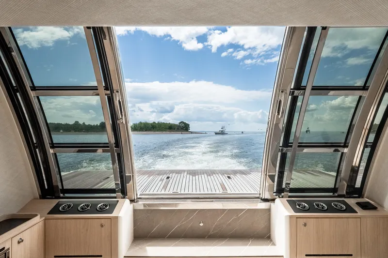 Slide: The Image of Luxurious interior view from 2022 Absolute 64 Navetta yacht, showcasing expansive ocean scenery. - 54