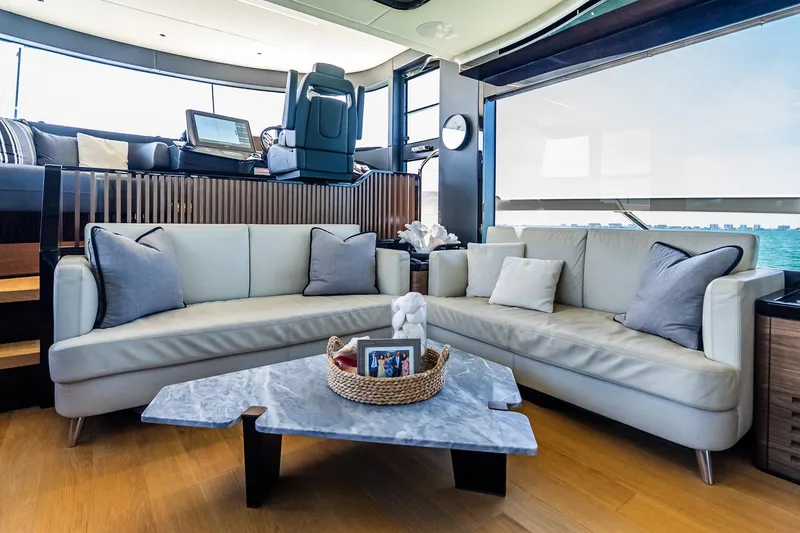 Slide: The Image of Luxurious interior of 2022 Absolute 64 Navetta yacht with elegant seating and sea view. - 72