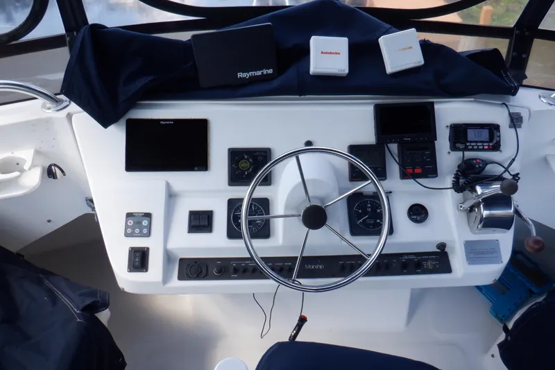 Slide: The Image of 1999 Mainship 350 Trawler helm with navigation equipment and steering wheel. - 20