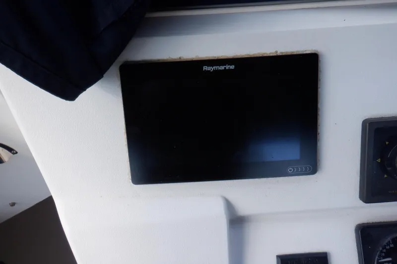 Slide: The Image of Raymarine display on 1999 Mainship 350 Trawler dashboard. - 21