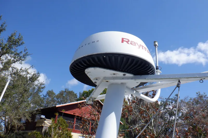 Slide: The Image of Radar system on 1999 Mainship 350 Trawler against blue sky background. - 28