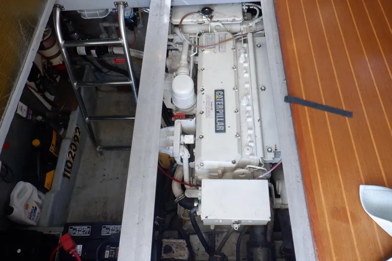 Slide: The Image of Engine compartment of 1999 Mainship 350 Trawler with Caterpillar engine. - 51