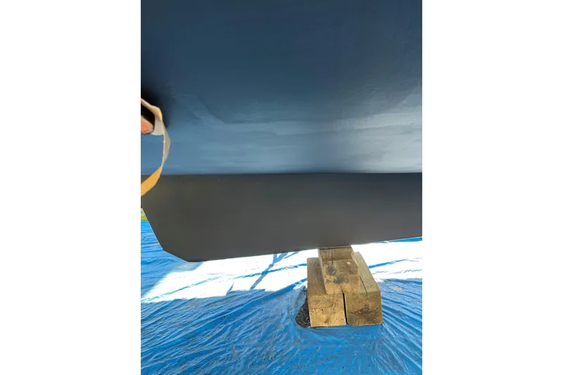 Slide: The Image of Bottom view of a 1999 Mainship 350 Trawler on wooden blocks. - 65