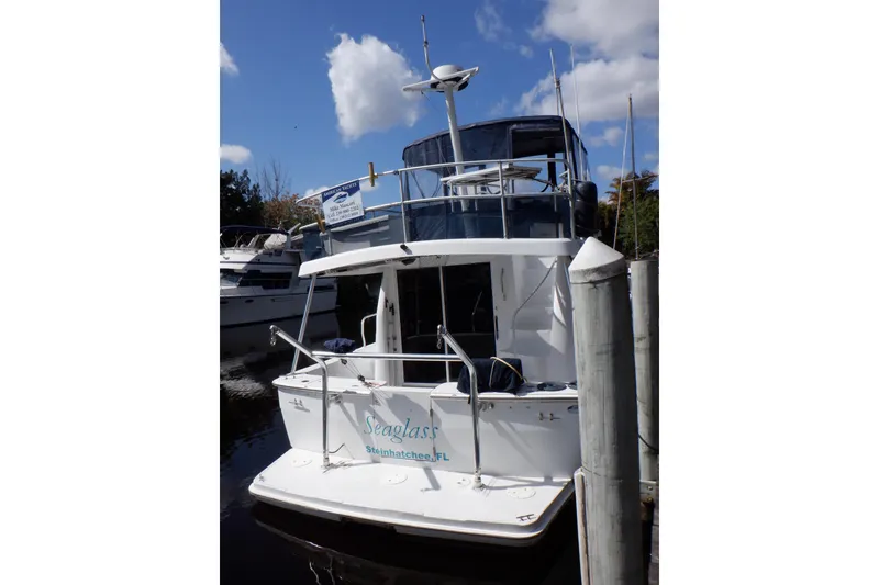 Slide: The Image of 1999 Mainship 350 Trawler docked, rear view, clear sky, Seaglass, Steinhatchee, FL. - 7