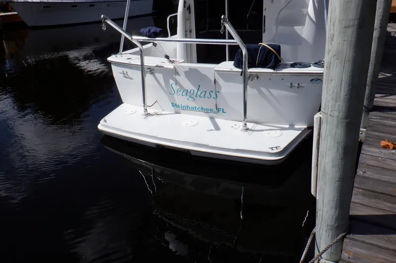 Slide: The Image of 1999 Mainship 350 Trawler docked, displaying "Seaglass" and "Steinhatchee, FL" on the stern. - 8