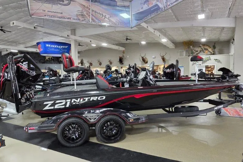 The Image of 2026 Nitro Z21 XL Pro boat displayed in showroom with sleek design and modern features. - 0