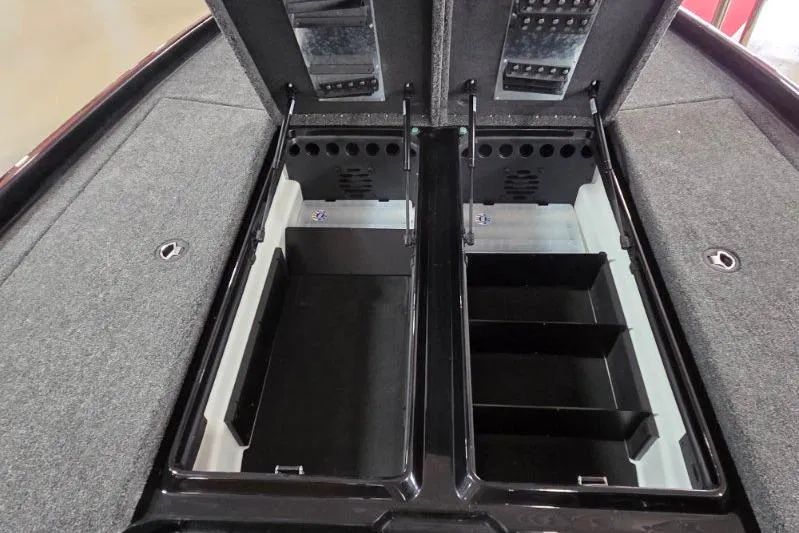 Slide: The Image of 2026 Nitro Z21 XL Pro boat storage compartments with open lids, showcasing organized interior space. - 10