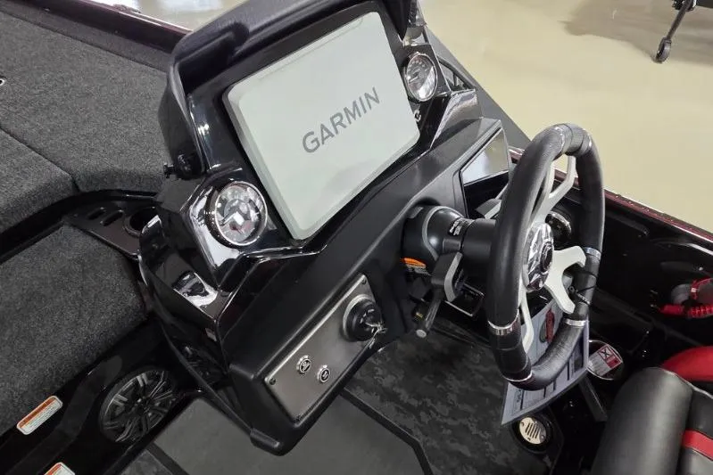 Slide: The Image of 2026 Nitro Z21 XL Pro boat dashboard with Garmin display and steering wheel. - 16