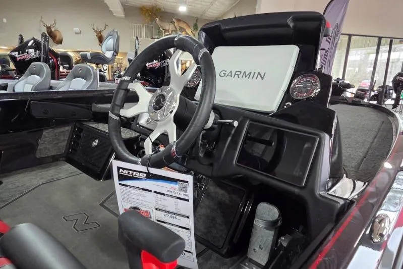 Slide: The Image of 2026 Nitro Z21 XL Pro boat interior with Garmin navigation system and steering wheel. - 17