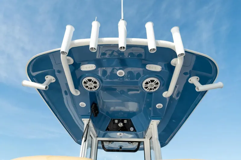 Slide: The Image of 2026 Sportsman Open 252 Center Console boat with rod holders and speakers. - 10