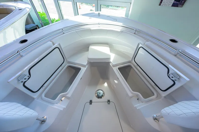 Slide: The Image of 2026 Sportsman Open 252 Center Console boat interior with open storage compartments. - 14