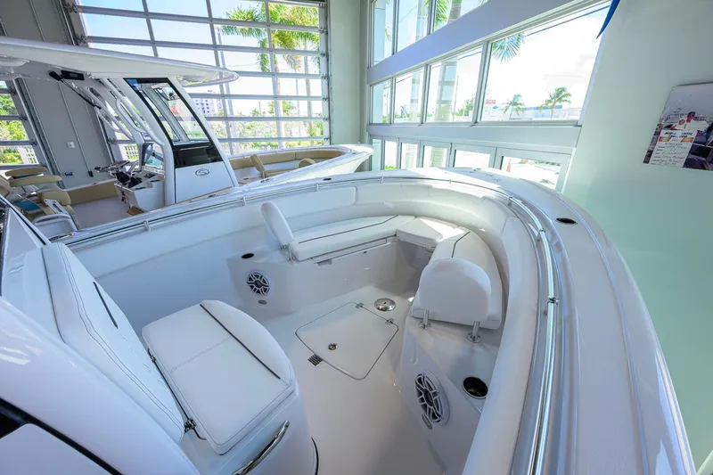 Slide: The Image of 2026 Sportsman Open 252 Center Console boat interior with sleek seating and modern design. - 19