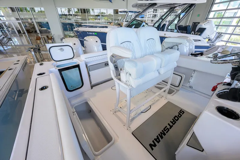 Slide: The Image of 2026 Sportsman Open 252 Center Console boat interior with seating and storage compartments. - 24