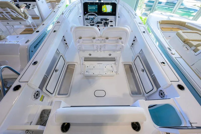 Slide: The Image of 2026 Sportsman Open 252 Center Console boat interior with advanced navigation system and seating. - 32