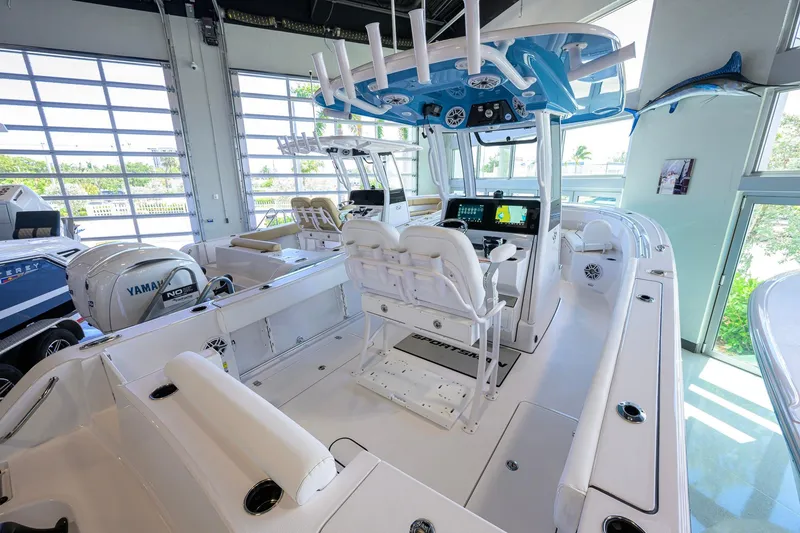 Slide: The Image of 2026 Sportsman Open 252 Center Console boat interior with advanced navigation system. - 33
